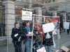 women in cage of coat hangars