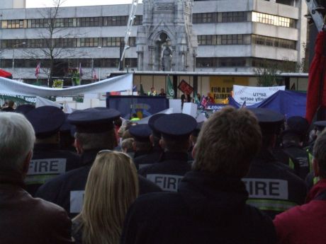 Listening to the speeches, on the Grand Parade.