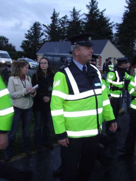 Sgt. Dermot Butler MY28, Belmullet, pictured with two of the four Frontline observers.