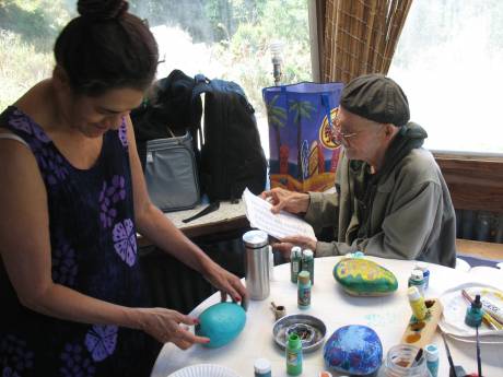 WAMM members painting memorial rocks for dead members