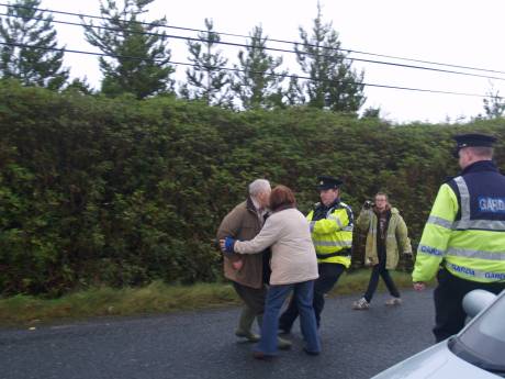 Click on image to see full-sized version Proters being pushed and pulled around by Gardaí